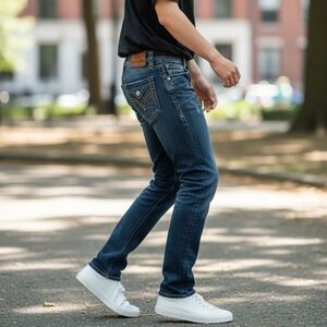 Rock Revival men’s straight leg jeans featuring a distressed blue wash